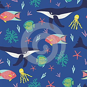Seamless pattern of playful humback whales, happy tropical fish, octapus, and bright corals on a blue background. photo