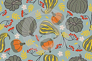 Seamless pattern with pumpkins and rowan branches. Vector graphics