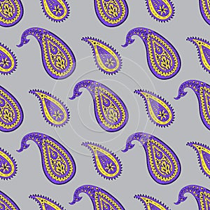 Seamless pattern with purple and yellow Paisley motifs on gray background