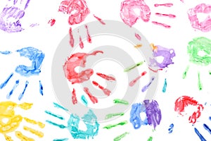 Seamless pattern with rainbow colored kids hand prints on white background