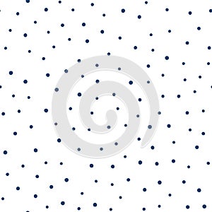 Seamless pattern with randomly scattered small round spots. Drawn by hand. Blue dots on a white background. photo