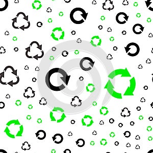 Seamless pattern with recycle symbols.