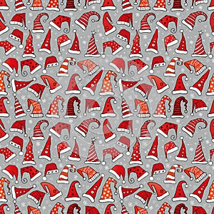 Seamless pattern with red Christmas Santa hats on grey background. Vector illustration.