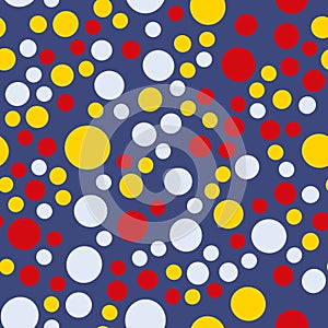 Seamless pattern red yellow  blue circles on blue background