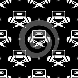 Seamless pattern with retro cassette tape and microphone illustration.