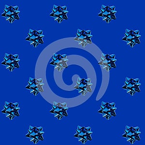 Seamless pattern of ribbon bow on blue background