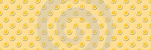 Seamless pattern with round slices of orange on yellow background.