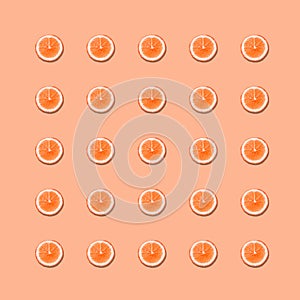 Seamless pattern with round slices of red orange on pink background.