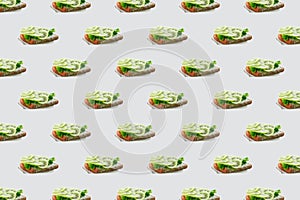 Seamless pattern of sandwiches with kiwi and soft cheese on a white background. Modern minimal food photography collage