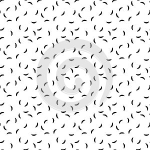 Seamless pattern of short curves. Black worms on white background. Abstract vector pattern