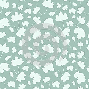 Seamless pattern with of falling leaves of a tree: maple, oak leaf and acorn.