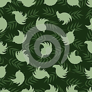Seamless pattern of silhouettes of birds and rowan leaves. Mood Color - Green
