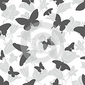 Seamless pattern with silhouettes of butterflies on a white background.