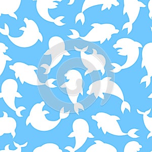 Seamless pattern with silhouettes of dolphins