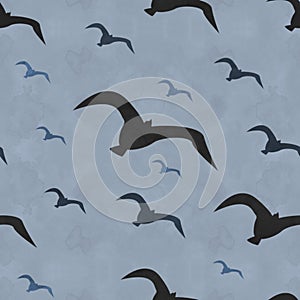 seamless pattern of silhouettes of flying birds in gray colors