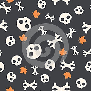 Seamless pattern with skulls, bones and autumn leaves. Halloween background