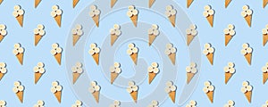 Seamless pattern of stylish mockup with banana slices in an ice cream waffle cone on a pastel blue background. Creative