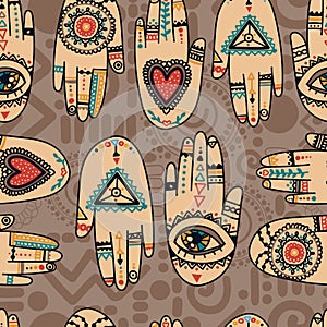 Seamless pattern with tattooed hands and ethnic or esoteric symbols