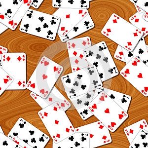 Seamless pattern texture background playing cards irregularly scattered on the woody table