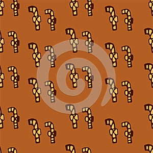 Seamless pattern of thin brown outline candy cand with ribbon isolated on brown background. hand drawn vector. doodle for christma