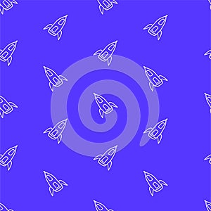 Seamless pattern with thin white outline rocket icon isolated on blue background.
