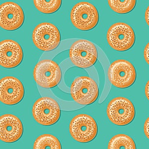 Seamless pattern, top view of fresh bagels with white and brown sesame seeds. Vector illustration. photo