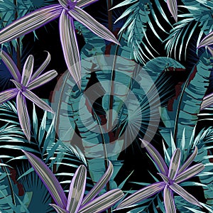 Seamless pattern with tropical plants. Dark and bright palm leaves on the black background.