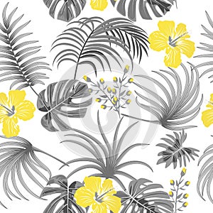 Seamless pattern of ultimate gray tropical leaves of palm tree and illuminating yellow flowers