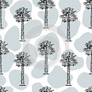 Seamless pattern vintage hand drawn illustration with palm tree in engraving style. Sketch of a tree.Contemporary modern trendy .