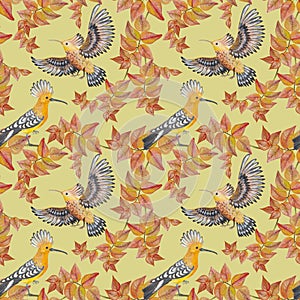 Seamless pattern with watercolor birds on a yellow background.