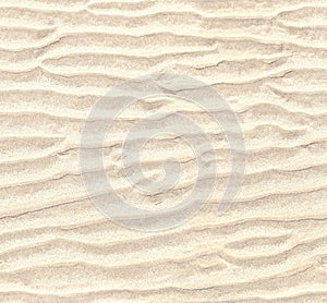 Seamless pattern of white sand. Repeating texture of waves on sandy beach background