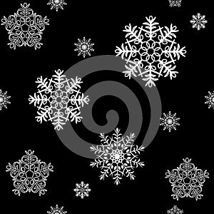 Seamless pattern with white snowflakes.