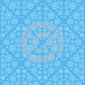 Seamless pattern of white snowflakes on a blue background. Vector illustration