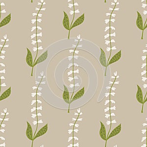 Seamless pattern of white tinkerbell flowers on a beige background.