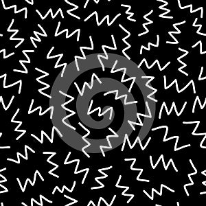 Seamless pattern. White zigzags on a black background. Art Texture