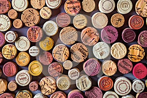 A seamless pattern of wine corkage, arranged in an artistic display on the wall, showcasing different colors and textures. th photo