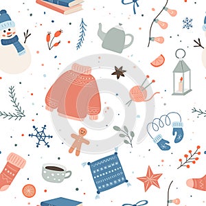 Seamless pattern with winter themed items like sweaters, mittens, candles, gingerbread, snowman and cozy seasonal decor photo