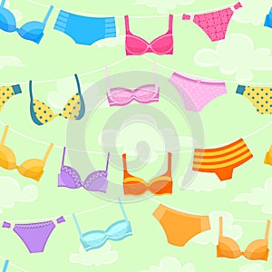 Seamless pattern with women`s lingerie hanging at rope