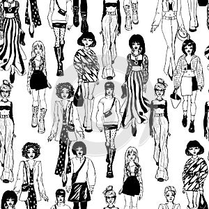 Seamless pattern. Women in trendy clothes. Defile sketch.