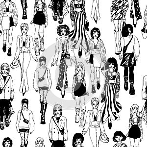 Seamless pattern. Women in trendy clothes. Defile sketch.