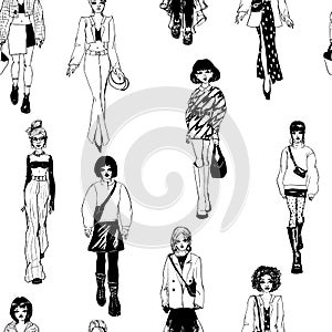 Seamless pattern. Women in trendy clothes. Defile sketch.