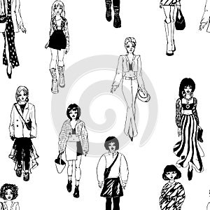 Seamless pattern. Women in trendy clothes. Defile sketch.