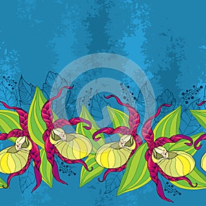 Seamless pattern with yellow Cypripedium calceolus or Lady's slipper orchid and green leaves on the textured blue background.