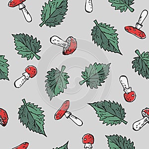 Seamless poisonous blody-red amanita mushrooms and green stinging nettle leaves print. 