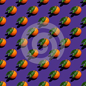 Seamless pop-art pattern of mandarin on purple background