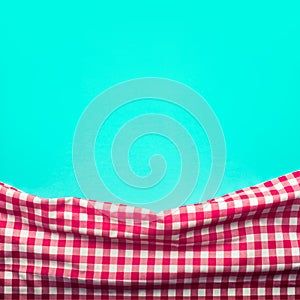 Seamless red checkered fabric with green background.