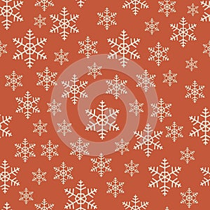 Seamless red and white Christmas snowflake pattern.