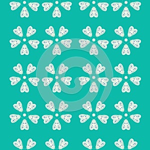 Seamless repeat pattern background of green and cream moths in flowers shapes. A vector background of insects. photo