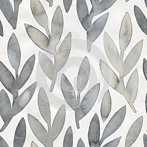 Seamless repeatable pattern with soft gray leafy branches with artistic stains on light textured grungy paper.