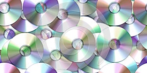 Seamless scattered pile or stack of vintage compact discs (CDs, DVDs or CD-ROMs)